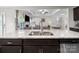 Kitchen with granite countertops, a double sink, stainless steel appliances, and an open view to the living area at 117 Autumn Mist Rd, Statesville, NC 28677
