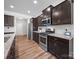 Bright kitchen featuring stainless steel appliances, granite countertops, and lots of storage space at 117 Autumn Mist Rd, Statesville, NC 28677
