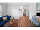 A modern living room with an open floor plan, hardwood flooring, and plenty of natural light at 117 Autumn Mist Rd, Statesville, NC 28677