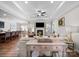 Open-concept living room featuring tray ceilings, a fireplace, and seamless flow to the kitchen and dining area at 117 Autumn Mist Rd, Statesville, NC 28677