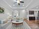 Spacious living room that connects to the kitchen and dining area, featuring hardwood floors and neutral decor at 117 Autumn Mist Rd, Statesville, NC 28677