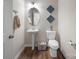 Charming powder room featuring a pedestal sink, oval mirror, and stylish decorative accents at 117 Autumn Mist Rd, Statesville, NC 28677