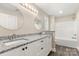 New bathroom featuring granite countertops, double sinks, and a tub and shower combo at 1234 Goodnight Ln, Kannapolis, NC 28081