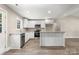 Modern kitchen with white cabinets, stainless steel appliances, and a center island at 1234 Goodnight Ln, Kannapolis, NC 28081