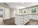 Bright kitchen featuring granite countertops, white cabinetry, and a center island at 1234 Goodnight Ln, Kannapolis, NC 28081