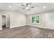 Bright living room featuring hardwood floors, neutral paint, and a ceiling fan at 1234 Goodnight Ln, Kannapolis, NC 28081