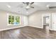 The living room is open and bright with new hardwood floors and natural light from the window at 1234 Goodnight Ln, Kannapolis, NC 28081