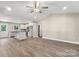 Open concept living space with hardwood floors, opening to the kitchen and dining area at 1234 Goodnight Ln, Kannapolis, NC 28081