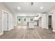 Spacious living area with hardwood floors flowing to the kitchen and dining area at 1234 Goodnight Ln, Kannapolis, NC 28081