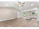 Spacious living area featuring hardwood floors and a smooth flow into the kitchen at 1234 Goodnight Ln, Kannapolis, NC 28081