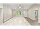 Bright living room featuring hardwood floors, ceiling fan, and a view of the outdoors at 1234 Goodnight Ln, Kannapolis, NC 28081