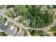 Aerial view of a home surrounded by mature trees and located on a cul-de-sac at 1399 Verdict Ridge Dr, Denver, NC 28037