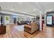 Finished basement providing a comfortable and spacious seating area, bar and access to outside at 1399 Verdict Ridge Dr, Denver, NC 28037