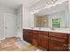 Bathroom featuring double vanity and tiled shower with glass door at 1399 Verdict Ridge Dr, Denver, NC 28037