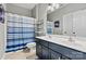 Bathroom featuring a double vanity and a shower and tub combo at 1399 Verdict Ridge Dr, Denver, NC 28037