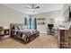Bedroom with fan, tv, desk and Carolina Panthers decor at 1399 Verdict Ridge Dr, Denver, NC 28037
