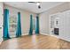 Bedroom featuring hardwood floors and bright teal curtains with a view of the bathroom at 1399 Verdict Ridge Dr, Denver, NC 28037