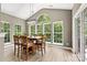 Bright dining room with a large window, vaulted ceiling, and stylish lighting fixture at 1399 Verdict Ridge Dr, Denver, NC 28037