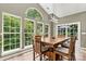 Light-filled dining area with large windows that offer panoramic views of the backyard at 1399 Verdict Ridge Dr, Denver, NC 28037