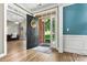Inviting foyer with hardwood floors and an open doorway leading to other rooms in the home at 1399 Verdict Ridge Dr, Denver, NC 28037