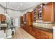 Well-appointed kitchen with dark wood cabinets, granite countertops, and stainless steel appliances at 1399 Verdict Ridge Dr, Denver, NC 28037