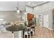Open-concept kitchen with a breakfast bar, stainless steel appliances, and seamless access to living area at 1399 Verdict Ridge Dr, Denver, NC 28037