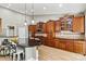 Expansive kitchen with a breakfast bar, custom cabinetry, granite countertops, and stainless steel appliances at 1399 Verdict Ridge Dr, Denver, NC 28037