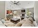 Open-concept living area with a cozy fireplace, large sectional sofa, and seamless flow to the kitchen at 1399 Verdict Ridge Dr, Denver, NC 28037