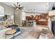 Expansive living space merging seamlessly with a modern kitchen; featuring a fireplace at 1399 Verdict Ridge Dr, Denver, NC 28037