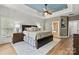 Spacious main bedroom featuring hardwood floors, fan, and blue ceiling detail at 1399 Verdict Ridge Dr, Denver, NC 28037