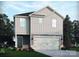 Charming two-story home with a two-car garage, tidy landscaping and vertical siding at 1413 31St Ne St, Conover, NC 28613