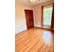 Hardwood floors in this bedroom get lots of natural light from the window at 1901 Taylor Dr, Gastonia, NC 28052