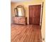 Bedroom with hardwood floors, natural light, and a large dresser with a mirror at 1901 Taylor Dr, Gastonia, NC 28052