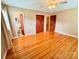 Spacious bedroom with hardwood floors, ceiling fan, and access to a bathroom and closet at 1901 Taylor Dr, Gastonia, NC 28052