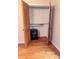 Bedroom closet featuring hardwood floors, shelf, and a safe at 1901 Taylor Dr, Gastonia, NC 28052
