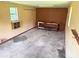 Shed featuring a concrete floor, wood shelves, and a window at 1901 Taylor Dr, Gastonia, NC 28052