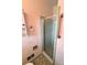 Bathroom shower stall with textured glass door and ceramic tile at 1901 Taylor Dr, Gastonia, NC 28052