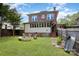 Backyard features a firepit with bench seating and lawn at 206 Mitchell Ave, Salisbury, NC 28144