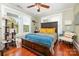 Bedroom featuring hardwood floors, fan, and a decorative cat tree at 206 Mitchell Ave, Salisbury, NC 28144