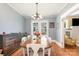 Bright dining room with hardwood floors, table, and view into another room at 206 Mitchell Ave, Salisbury, NC 28144