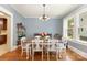 Elegant dining room with hardwood floors, chandelier, and a view to the backyard at 206 Mitchell Ave, Salisbury, NC 28144
