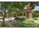 Inviting brick home with a cozy front porch and lush landscaping at 206 Mitchell Ave, Salisbury, NC 28144