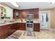View of the kitchen with stainless steel appliances and adjacent back door access at 206 Mitchell Ave, Salisbury, NC 28144