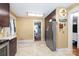 Spacious kitchen with stainless steel refrigerator and access to adjacent dining room at 206 Mitchell Ave, Salisbury, NC 28144