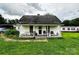 Welcoming front porch of a home, complete with seating and landscaping at 211 Oak Dr, Shelby, NC 28150