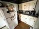 Galley kitchen with a refrigerator, ample cabinet space, and essential appliances at 211 Oak Dr, Shelby, NC 28150