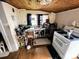 Cozy kitchen featuring wood ceilings, a sink with a window, and an electric range at 211 Oak Dr, Shelby, NC 28150