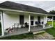 Charming front porch with a mix of seating options, perfect for relaxing outdoors at 211 Oak Dr, Shelby, NC 28150