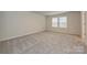Comfortable bedroom with neutral carpet and a window with a view at 2130 Sunflower Cir, Newton, NC 28658