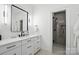 Modern bathroom featuring floating vanity with black hardware and glass shower at 21319 Baltic Dr, Cornelius, NC 28031